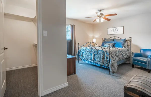 a bathroom with a sink a mirror and a shower