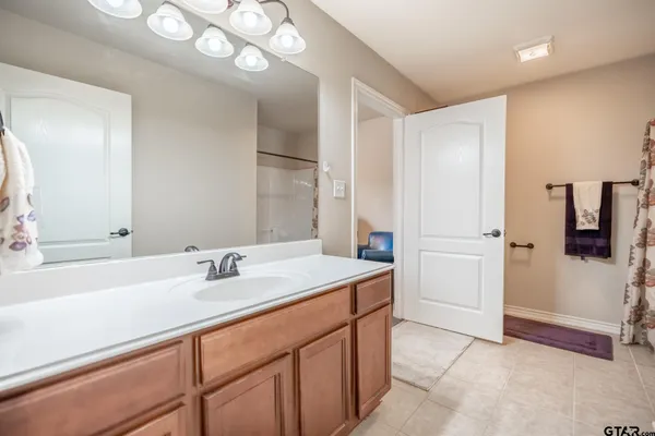a bathroom with a bathtub and shower
