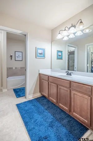 a bathroom with a toilet and a bath tub