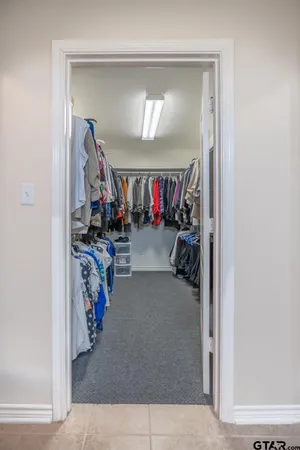 a bedroom with a bed and a television