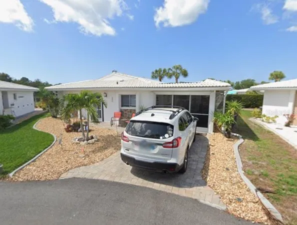 a car parked in front of a house