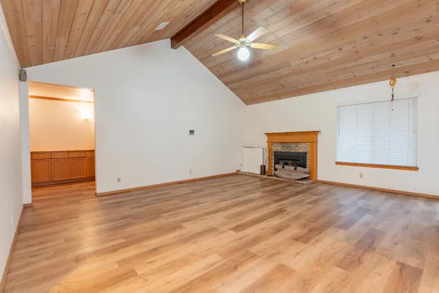 a view of a livingroom with wooden floor