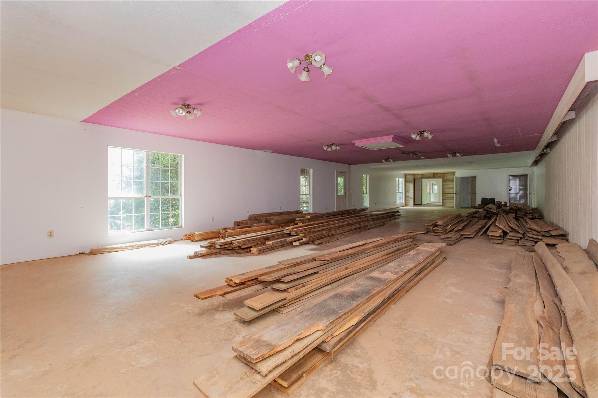 3290 Gerton Highway Gerton, NC 28735 - Photo 14 of 36 a room with gym equipment and a large window