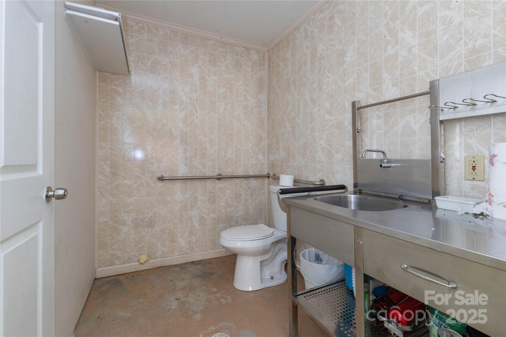 3290 Gerton Highway Gerton, NC 28735 - Photo 17 of 36 a bathroom with a granite countertop toilet and a sink