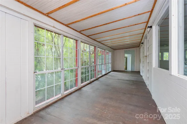 a view of entryway and hall with windows