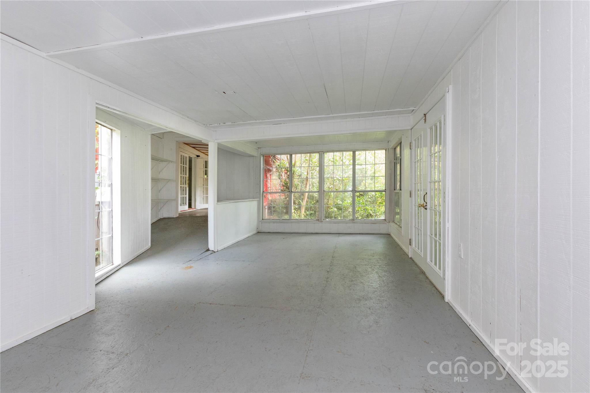 3290 Gerton Highway Gerton, NC 28735 - Photo 20 of 36 a view of a big room with wooden floor and windows