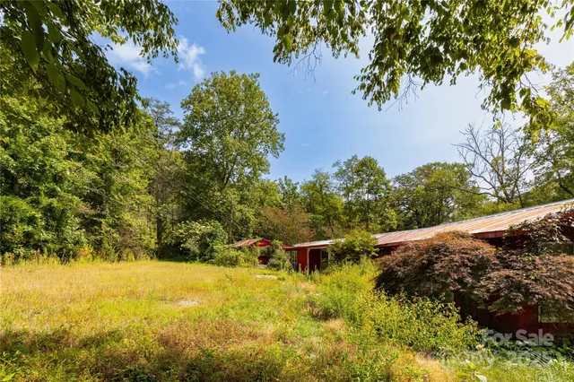 a view of a yard with an outdoor space