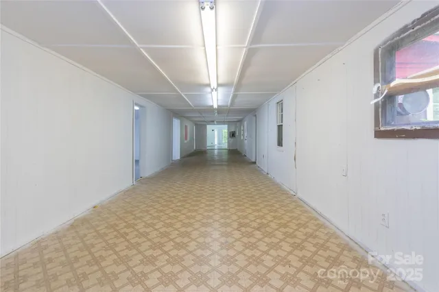 a view of an empty room with a large window