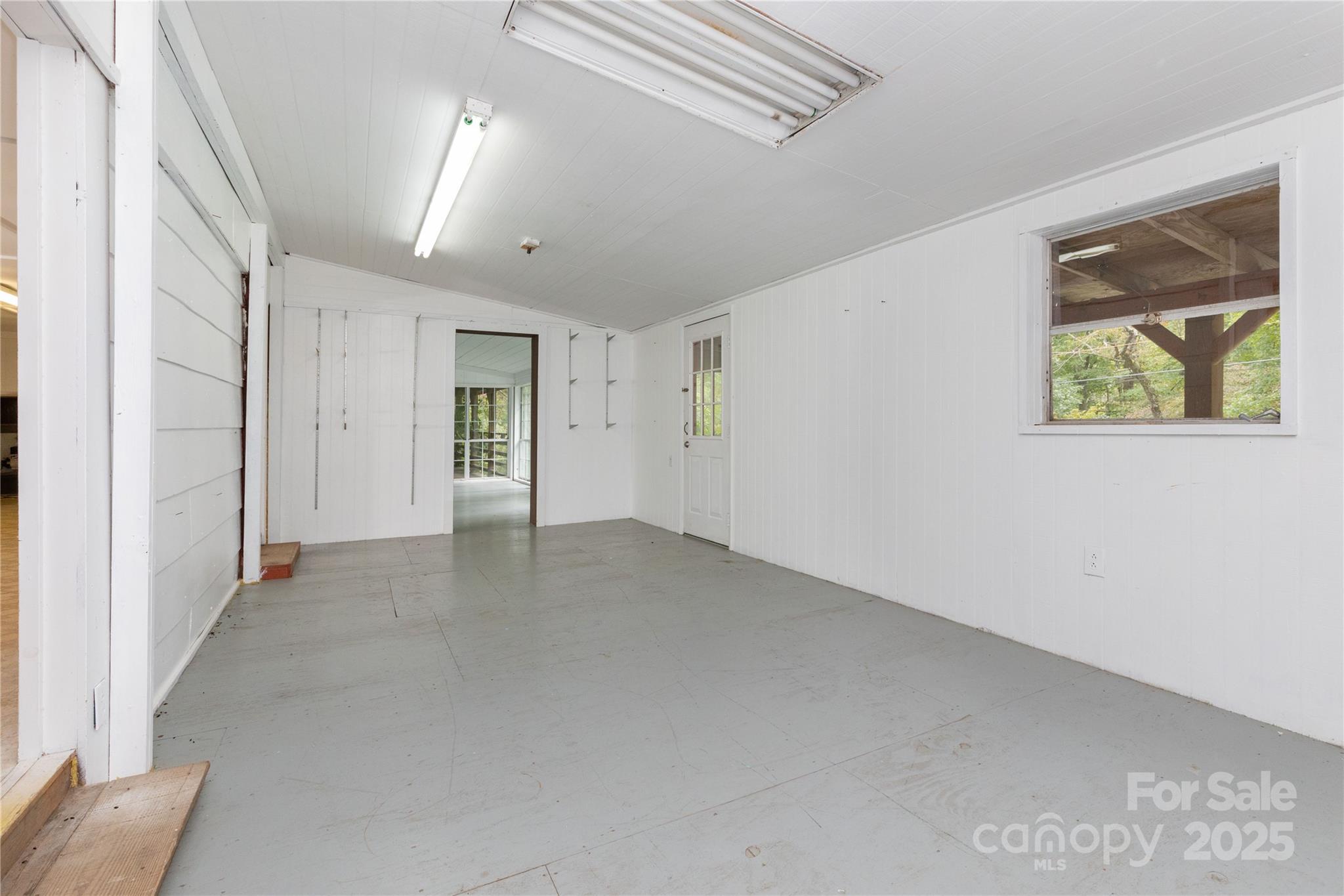 3290 Gerton Highway Gerton, NC 28735 - Photo 24 of 36 an empty room with windows and closet