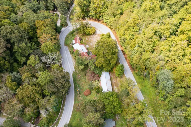an aerial view of houses with yard
