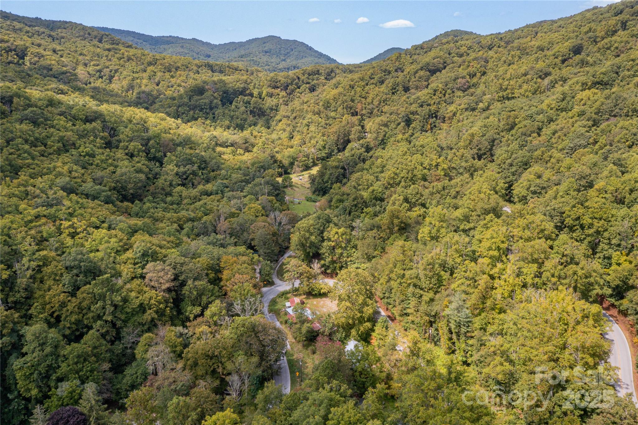 3290 Gerton Highway Gerton, NC 28735 - Photo 32 of 36 a view of a large building with mountains in the background
