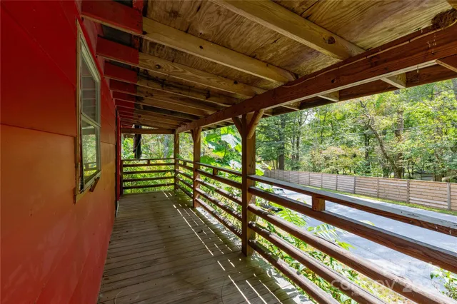 a view of empty room with wooden floor and outdoor space