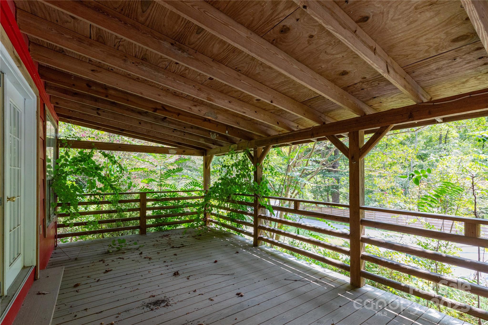 3290 Gerton Highway Gerton, NC 28735 - Photo 10 of 36 a view of empty room with wooden floor and outdoor space