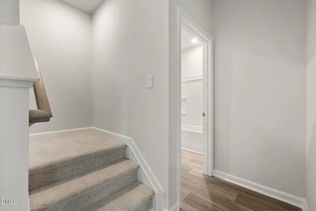 a view of staircase with wooden floor
