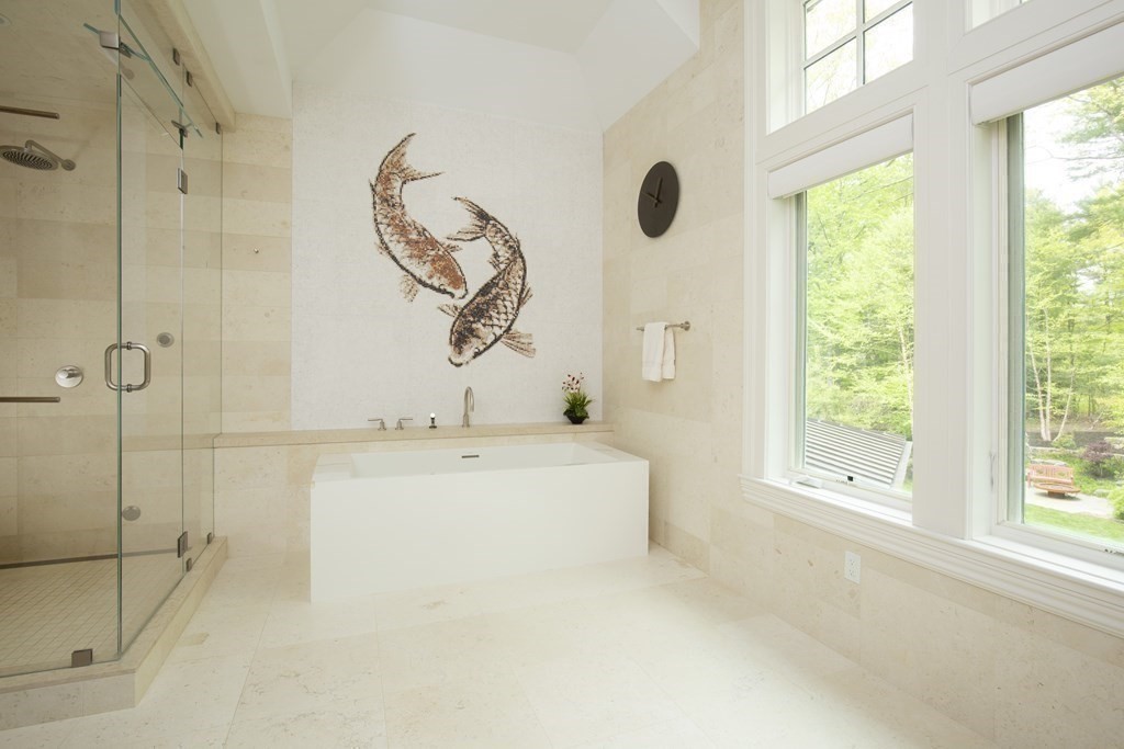 55 Ridge Hill Farm Road Wellesley, MA 02482 - Photo 18 of 32 a bathroom with a bathtub and a shower