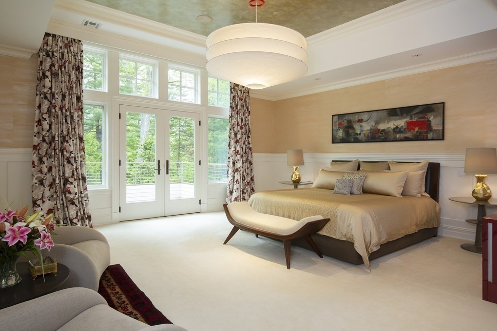 55 Ridge Hill Farm Road Wellesley, MA 02482 - Photo 19 of 32 a spacious bedroom with bed and a large window