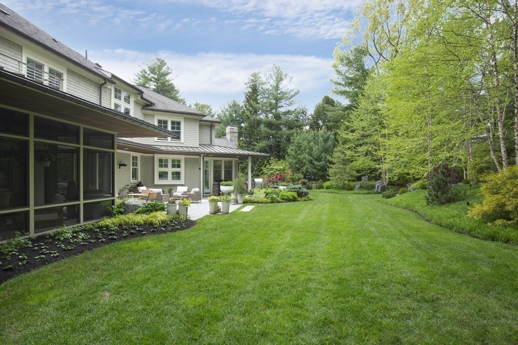 55 Ridge Hill Farm Road Wellesley, MA 02482 - Photo 26 of 32 a view of a house with a yard and sitting area