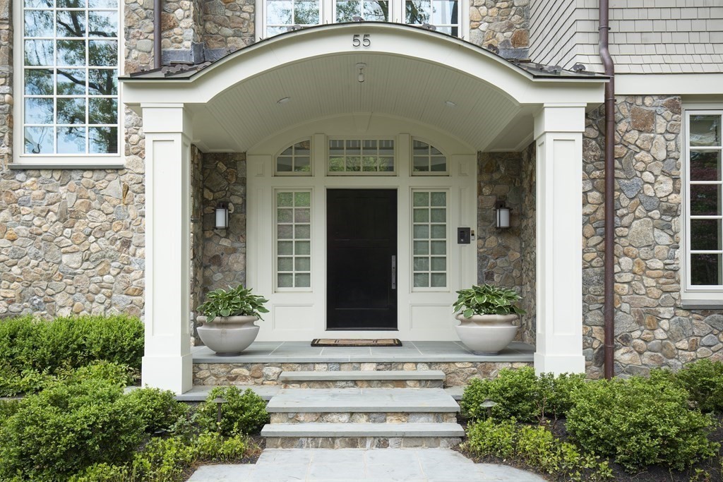 55 Ridge Hill Farm Road Wellesley, MA 02482 - Photo 29 of 32 a front view of a house with potted plants