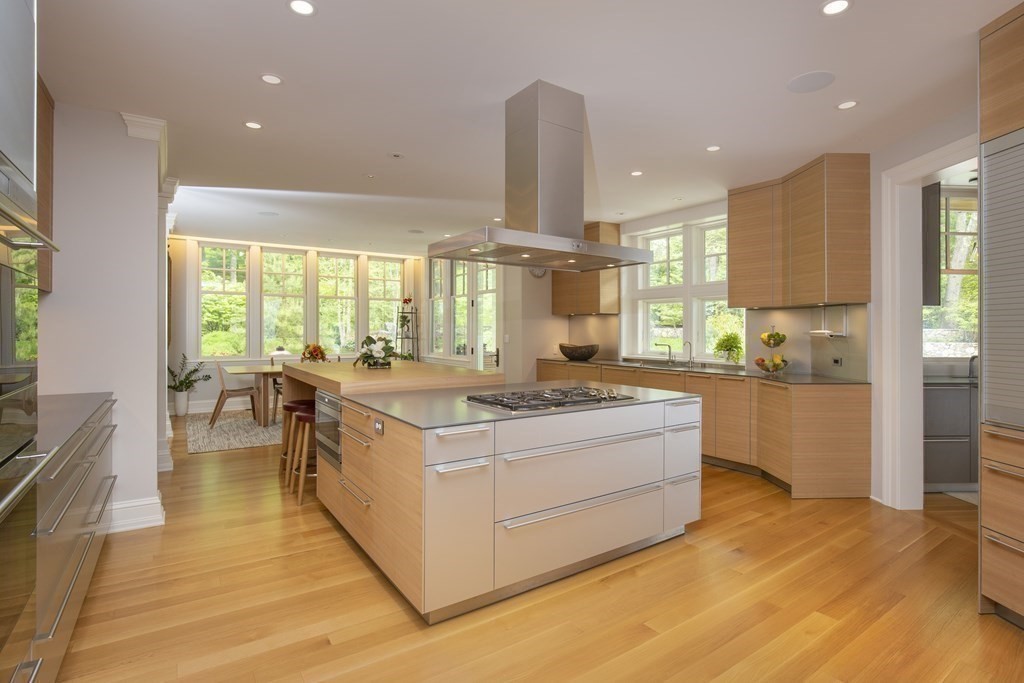 55 Ridge Hill Farm Road Wellesley, MA 02482 - Photo 8 of 32 a kitchen with stainless steel appliances granite countertop a stove and a large window