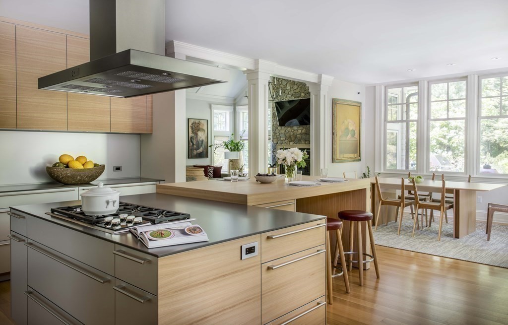 55 Ridge Hill Farm Road Wellesley, MA 02482 - Photo 9 of 32 a kitchen with a stove a table and chairs in it