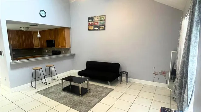 a living room with a couch and a flat screen tv