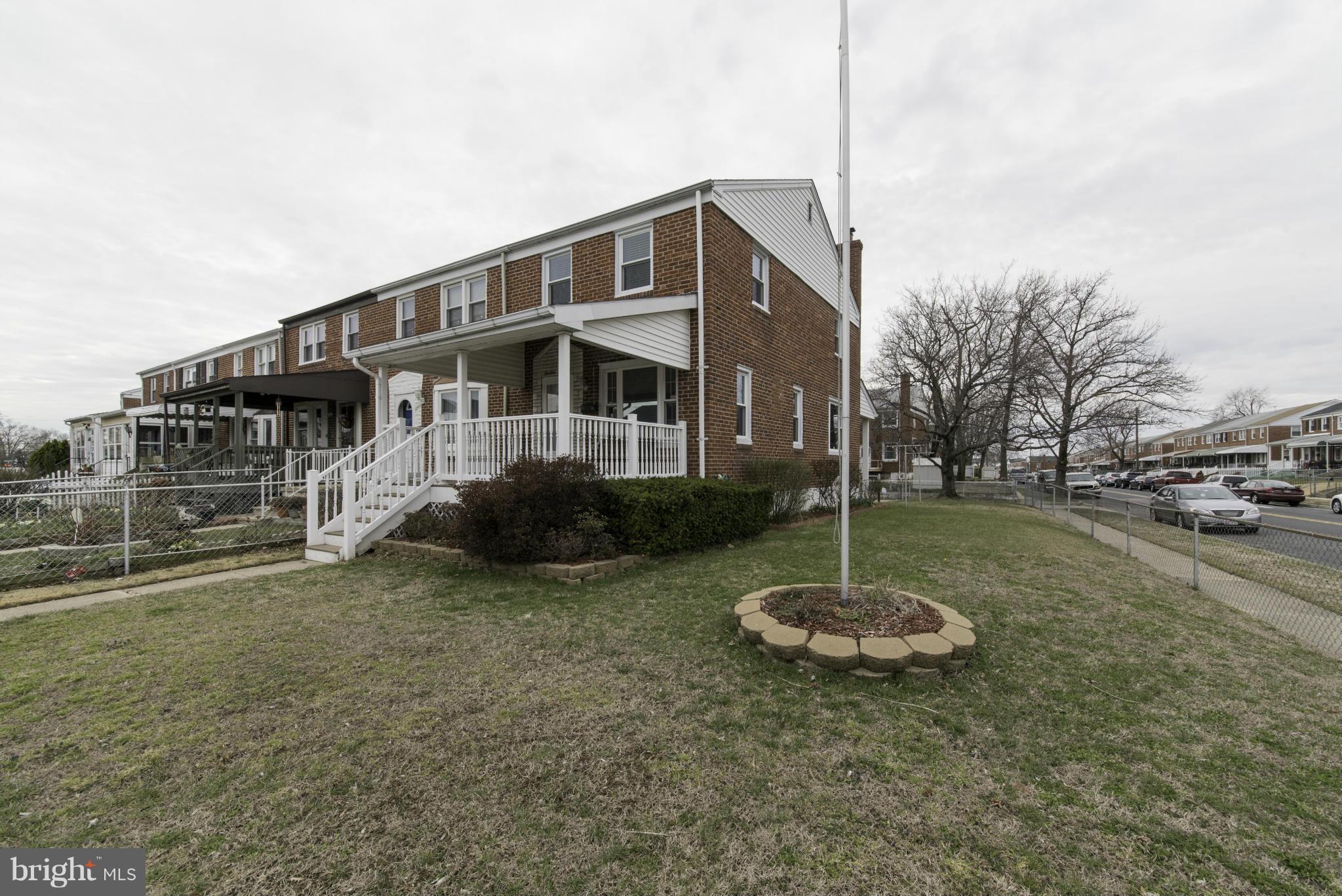 1900 Barry Road Baltimore, MD 21222 - Photo 1 of 30 a front view of a house with a yard