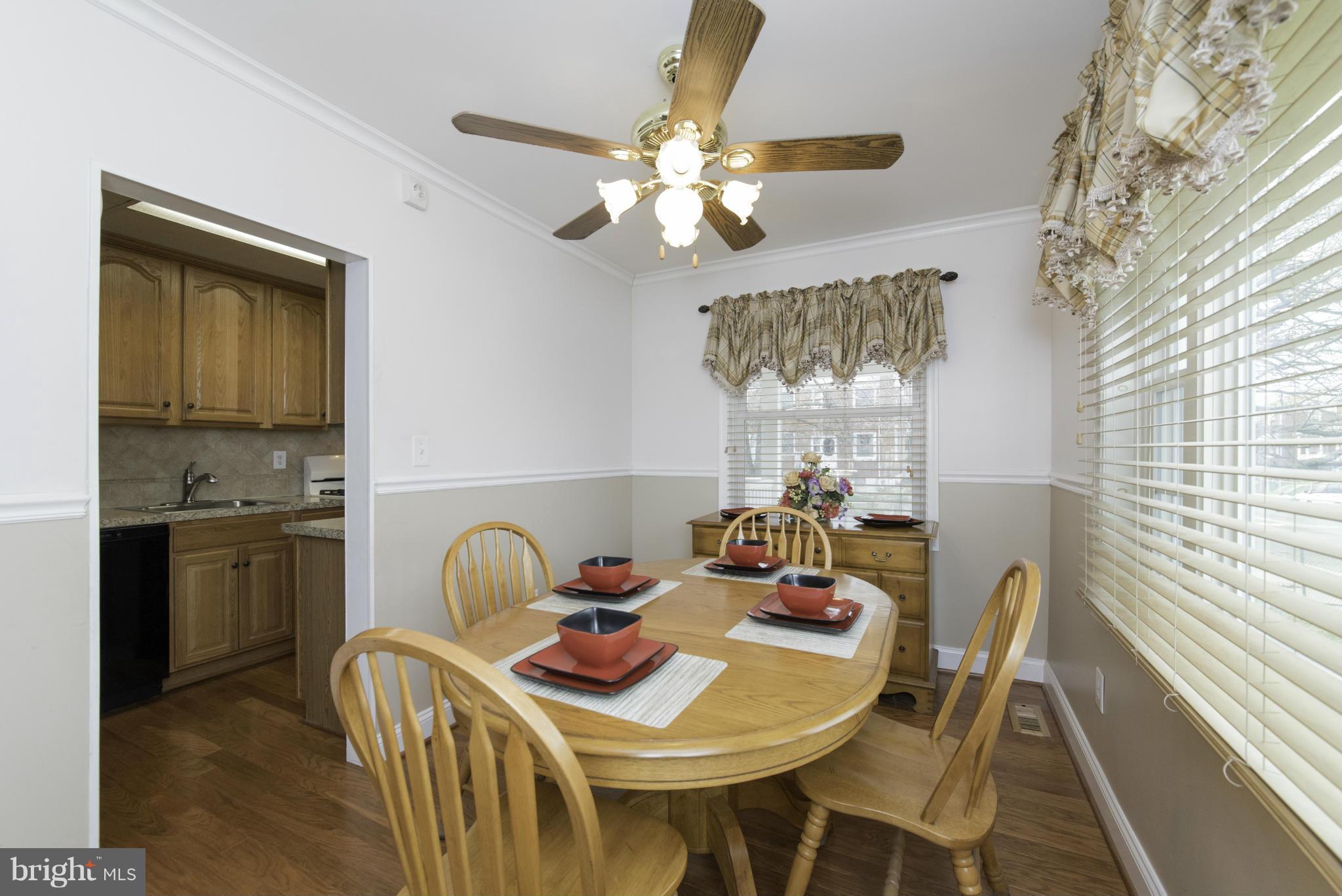 1900 Barry Road Baltimore, MD 21222 - Photo 11 of 30 a view of a dining room with furniture and chandelier