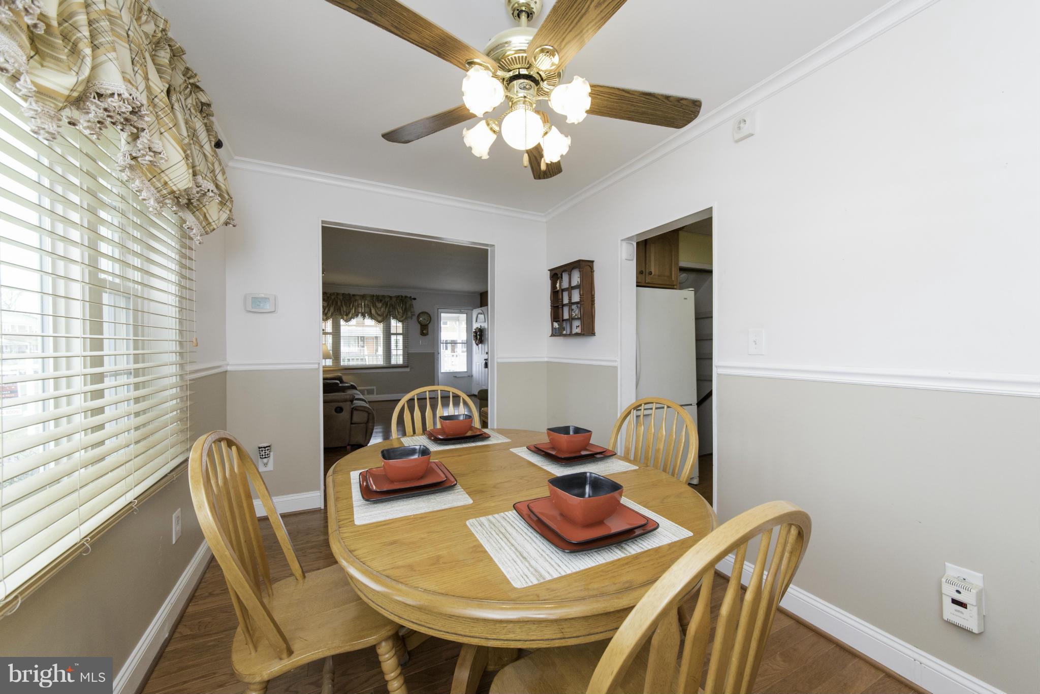 1900 Barry Road Baltimore, MD 21222 - Photo 13 of 30 a view of a dining room with furniture and a chandelier