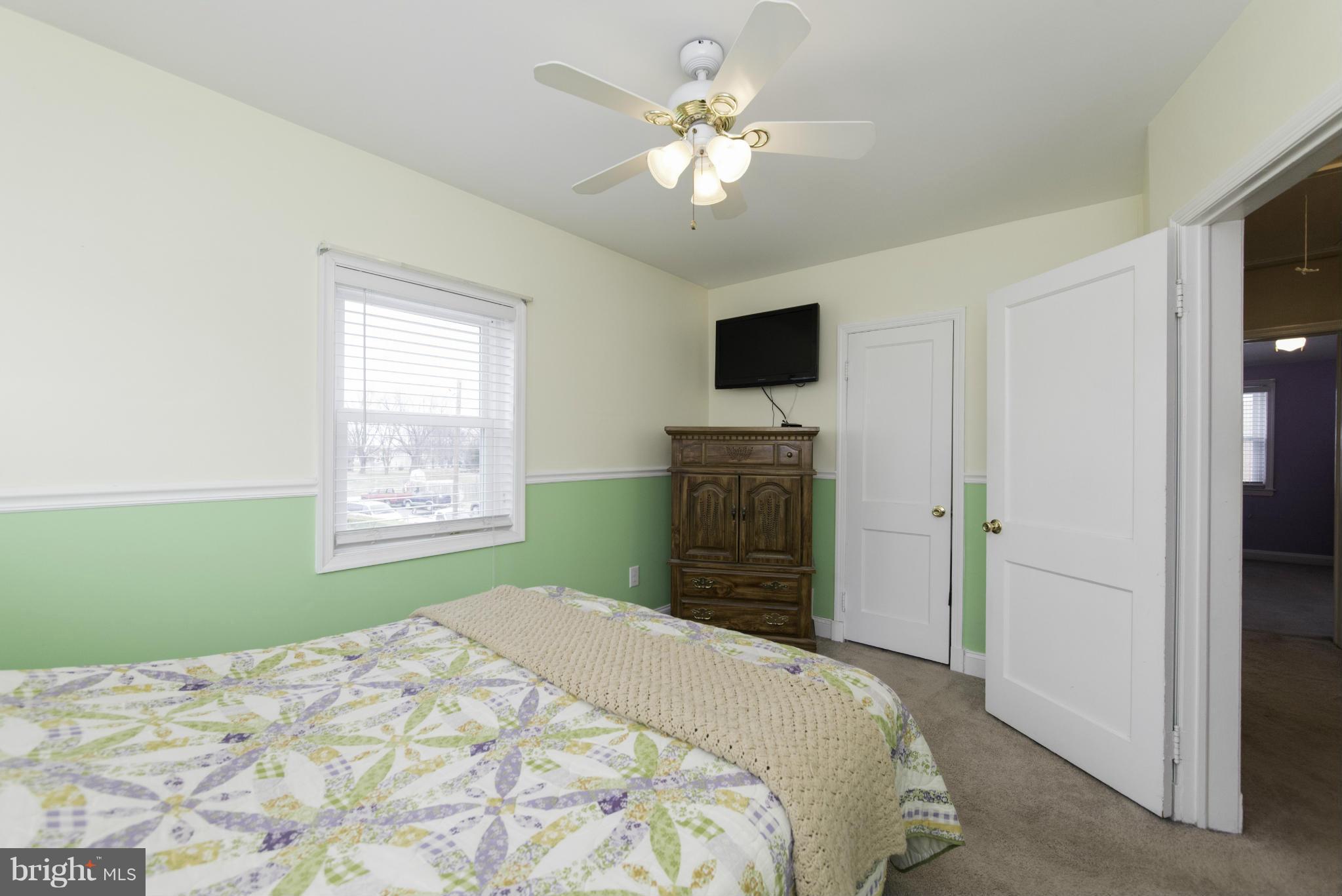 1900 Barry Road Baltimore, MD 21222 - Photo 20 of 30 a bedroom with a bed and a television