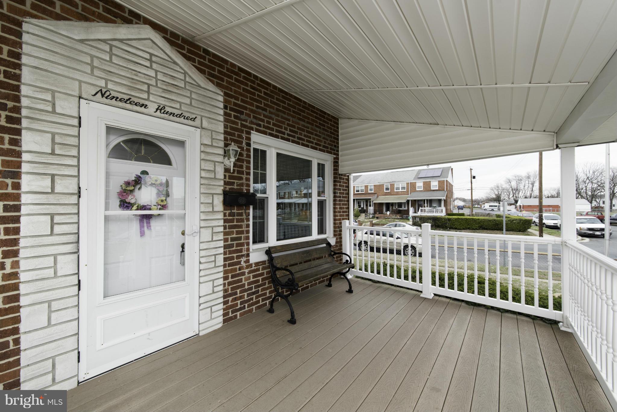 1900 Barry Road Baltimore, MD 21222 - Photo 3 of 30 a view of a porch with wooden floor and iron stairs