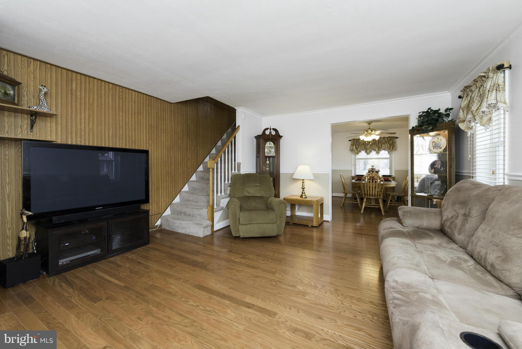 1900 Barry Road Baltimore, MD 21222 - Photo 5 of 30 a living room with furniture and a flat screen tv
