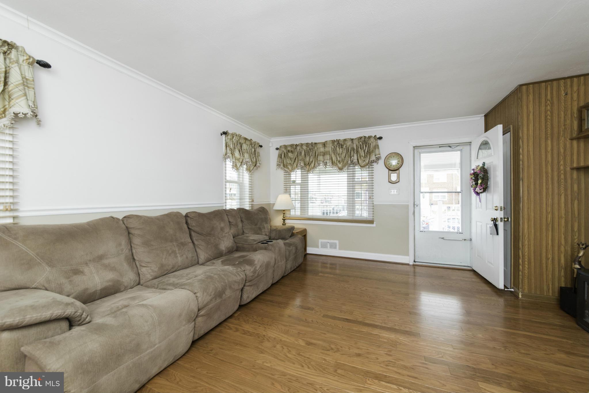 1900 Barry Road Baltimore, MD 21222 - Photo 7 of 30 a living room with furniture and a window