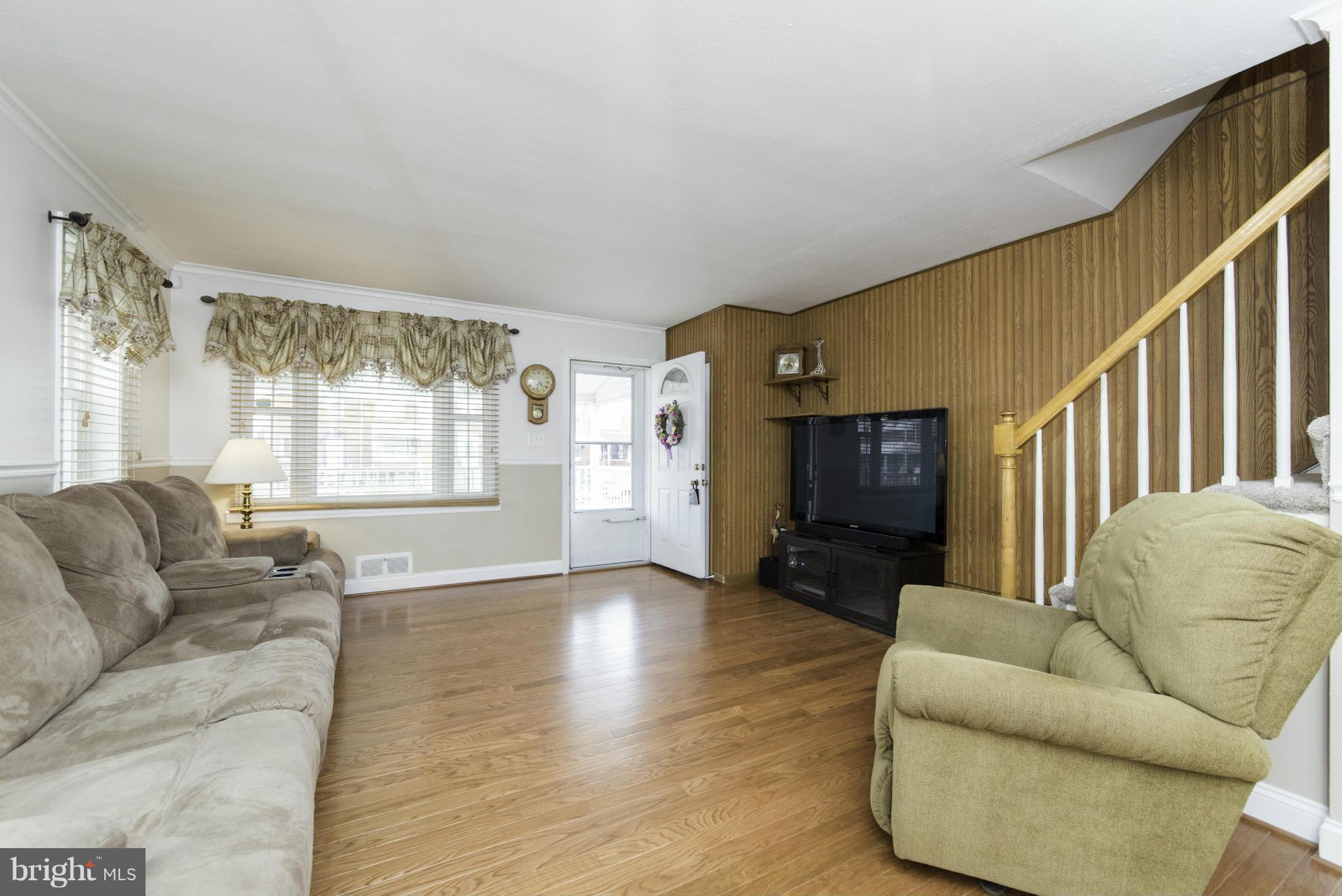 1900 Barry Road Baltimore, MD 21222 - Photo 8 of 30 a living room with furniture and a flat screen tv