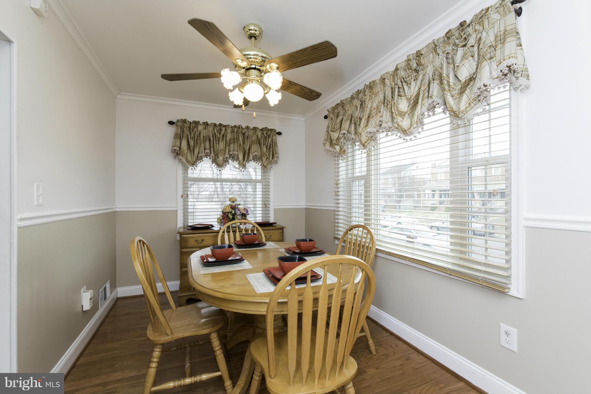 1900 Barry Road Baltimore, MD 21222 - Photo 10 of 30 a view of a dining room with furniture wooden floor and chandelier