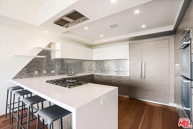 a kitchen with a table and chairs