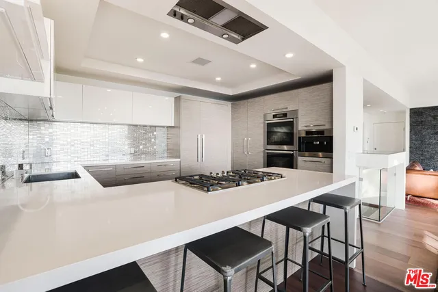 a kitchen with a table and chairs in it