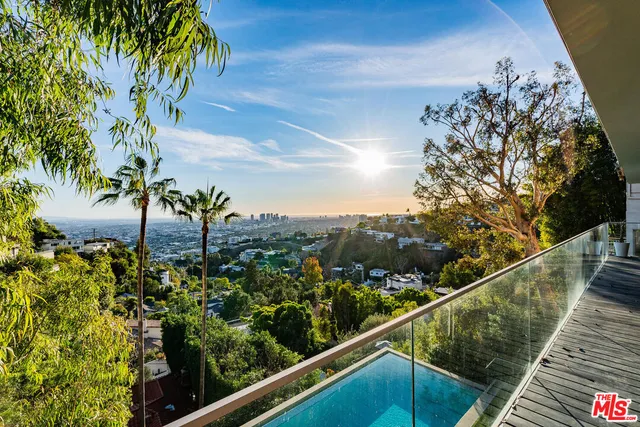 a view of a balcony with an outdoor seating
