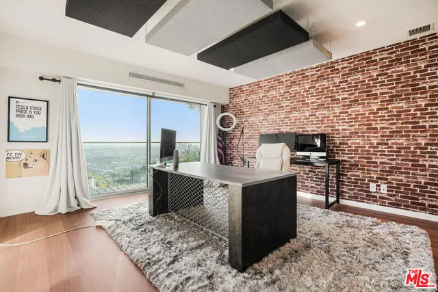 a view of kitchen with cabinets