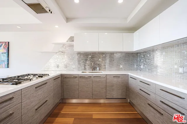 a kitchen with sink cabinets and stove