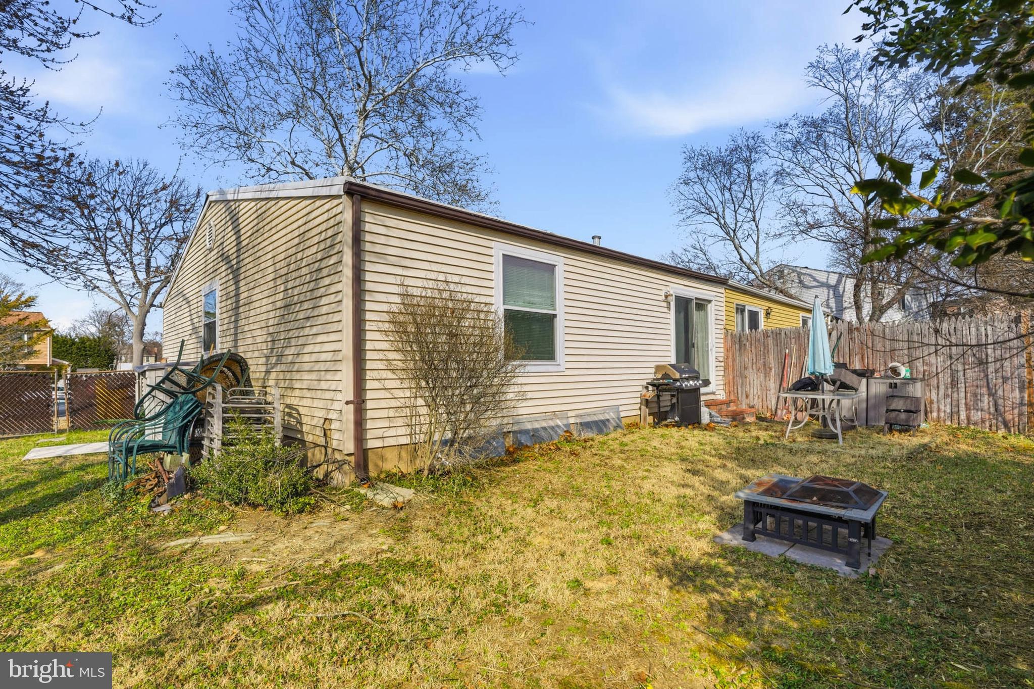 1359 Raleigh Drive Severn, MD 21144 - Photo 2 of 15 a backyard of a house with table and chairs
