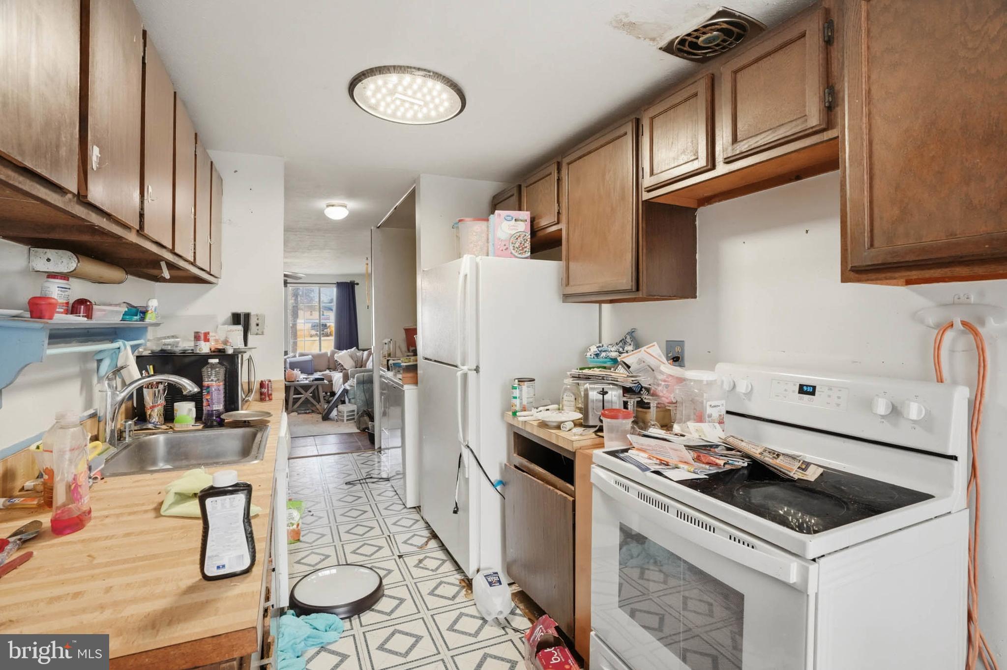 1359 Raleigh Drive Severn, MD 21144 - Photo 5 of 15 a kitchen with stainless steel appliances granite countertop a stove and a sink