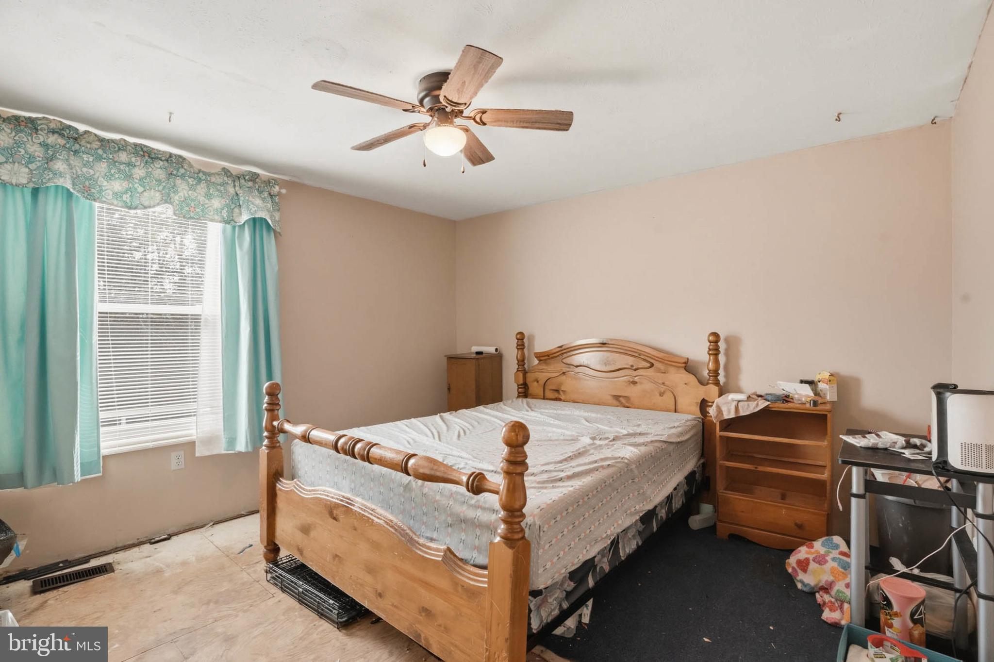 1359 Raleigh Drive Severn, MD 21144 - Photo 7 of 15 a bedroom with a bed and a chandelier