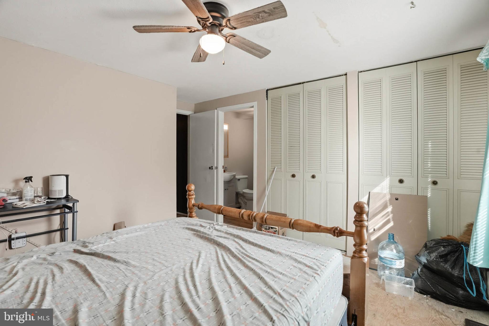 1359 Raleigh Drive Severn, MD 21144 - Photo 8 of 15 a bedroom with a bed and a chandelier