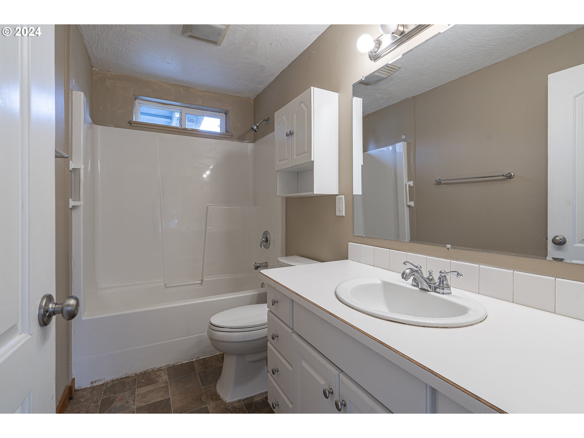1275 30th Street Springfield, OR 97478 - Photo 17 of 28 a bathroom with a sink toilet a mirror and shower