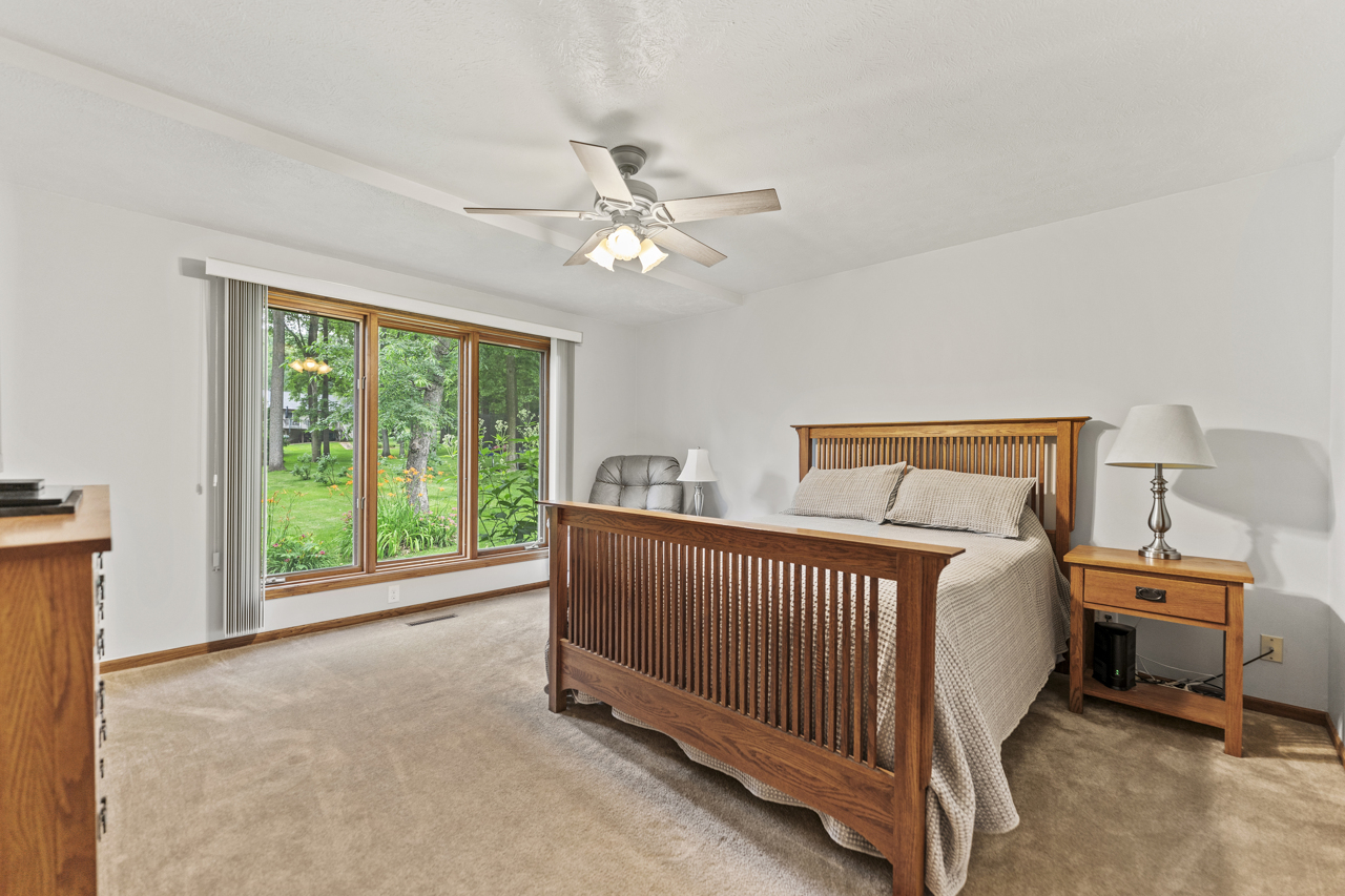1506 Pier Drive Davis, IL 61019 - Photo 14 of 47 a bedroom with a bed and a large window