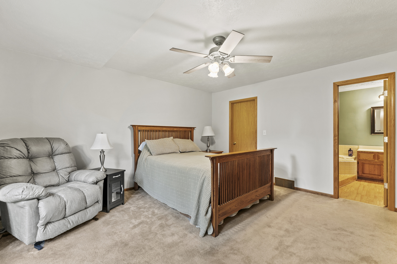 1506 Pier Drive Davis, IL 61019 - Photo 15 of 47 a bedroom with a bed and couch