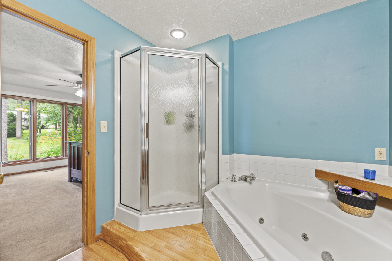 1506 Pier Drive Davis, IL 61019 - Photo 16 of 47 a bathroom with a tub and a shower
