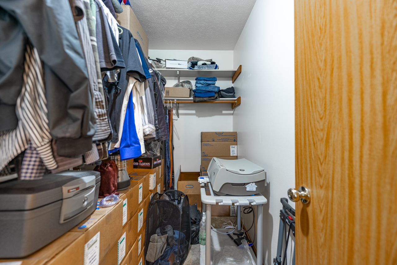 1506 Pier Drive Davis, IL 61019 - Photo 18 of 47 a view of walk in closet with clothes and shoes