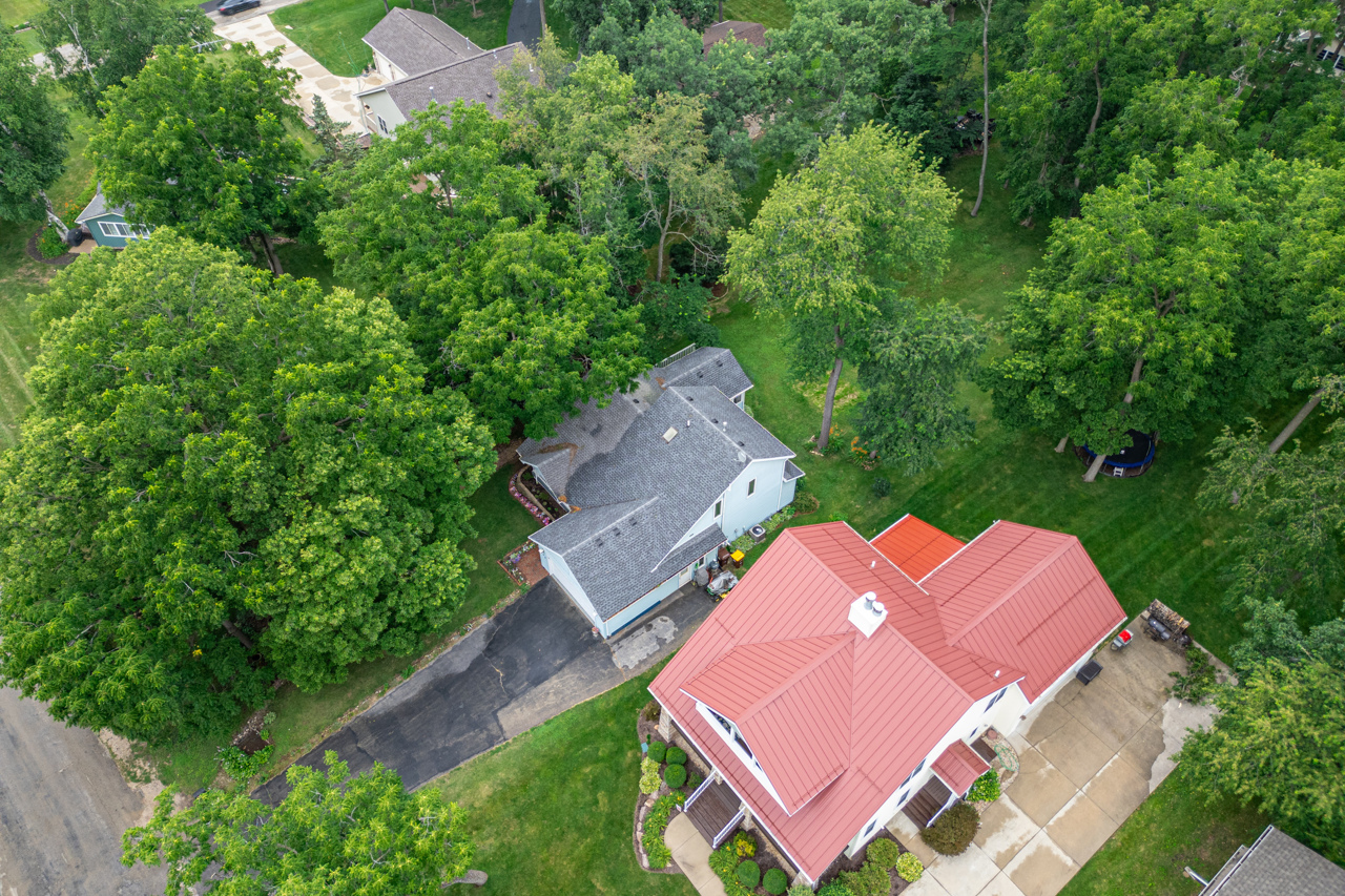 1506 Pier Drive Davis, IL 61019 - Photo 2 of 47 an aerial view of a house with yard and outdoor seating