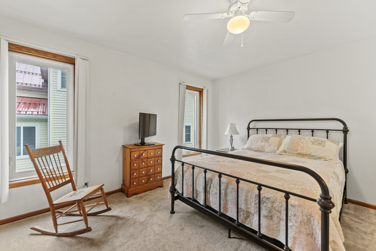 1506 Pier Drive Davis, IL 61019 - Photo 22 of 47 a bedroom with a bed and wooden floor
